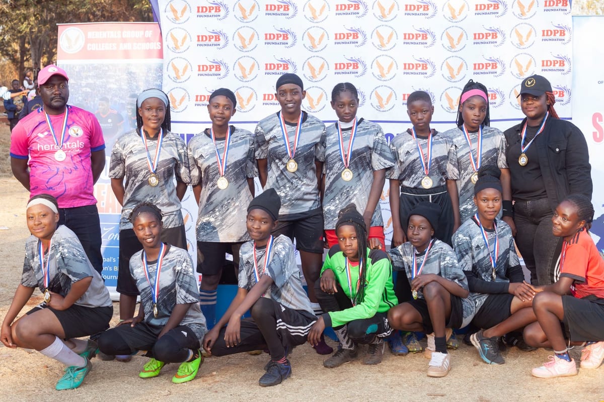 Secondary girls football team with medals after a competition