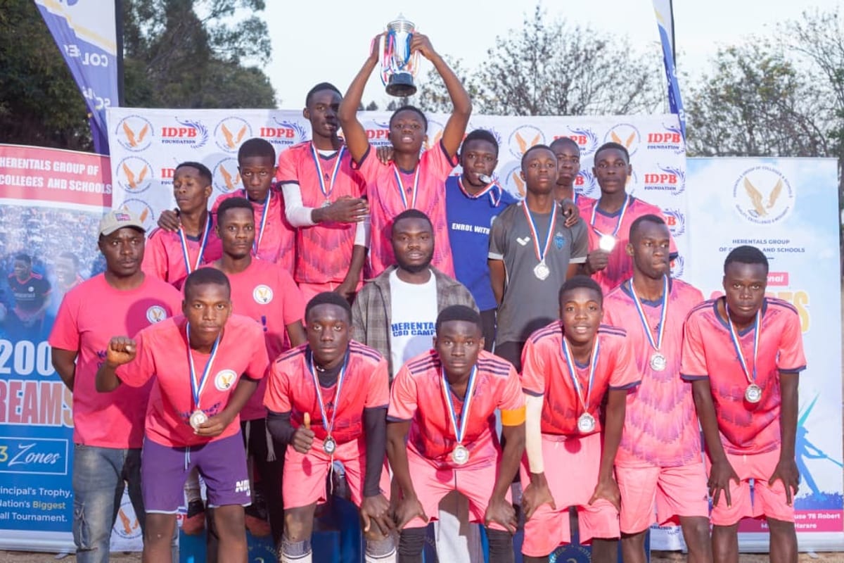 Secondary boys football team celebrating with medals